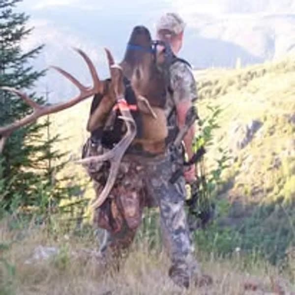 Joel Swecker packing out an elk in the Washington backcountry
